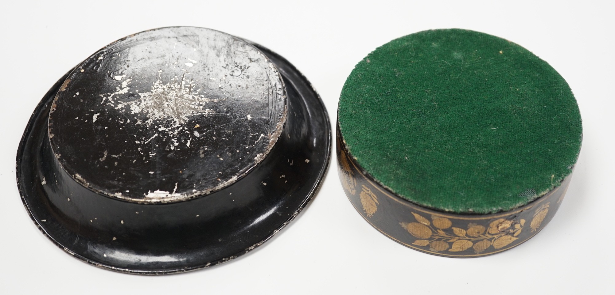 A Regency toleware coaster and a similar papier maché coaster, largest 16cm diameter